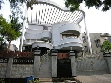 a house with a fence and trees