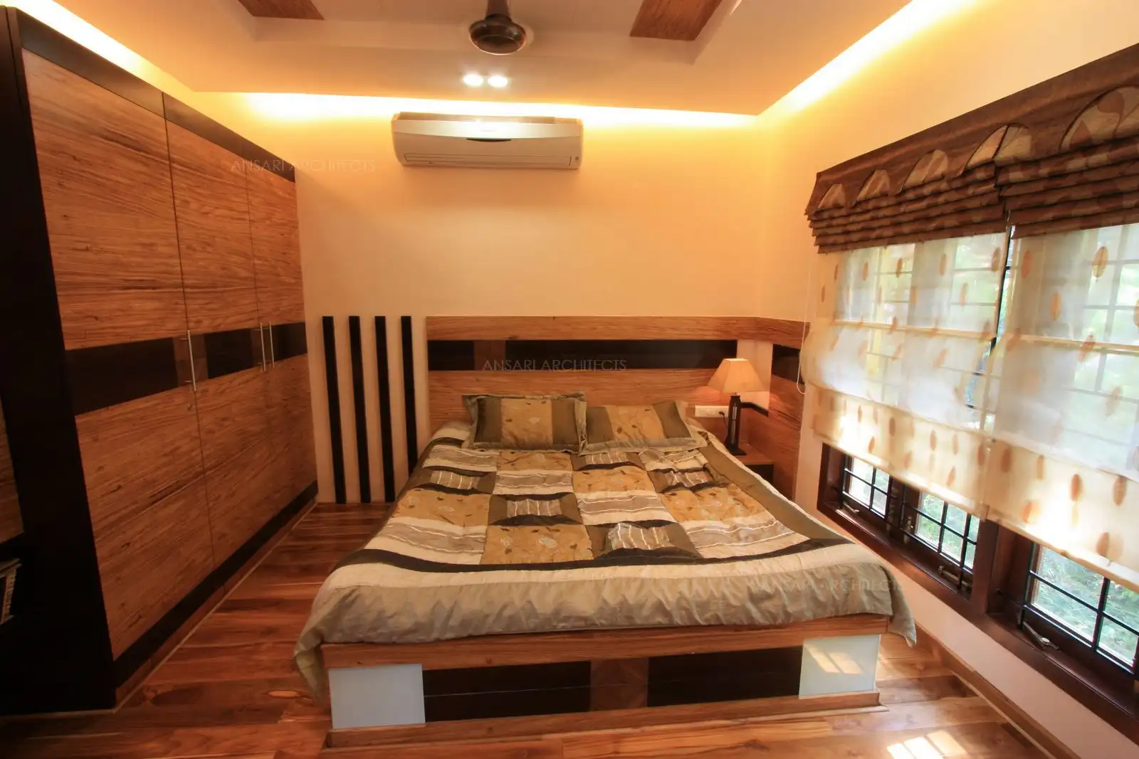 Light colour veneer has been combined with contrast strips of black veneer to break the monotony.
