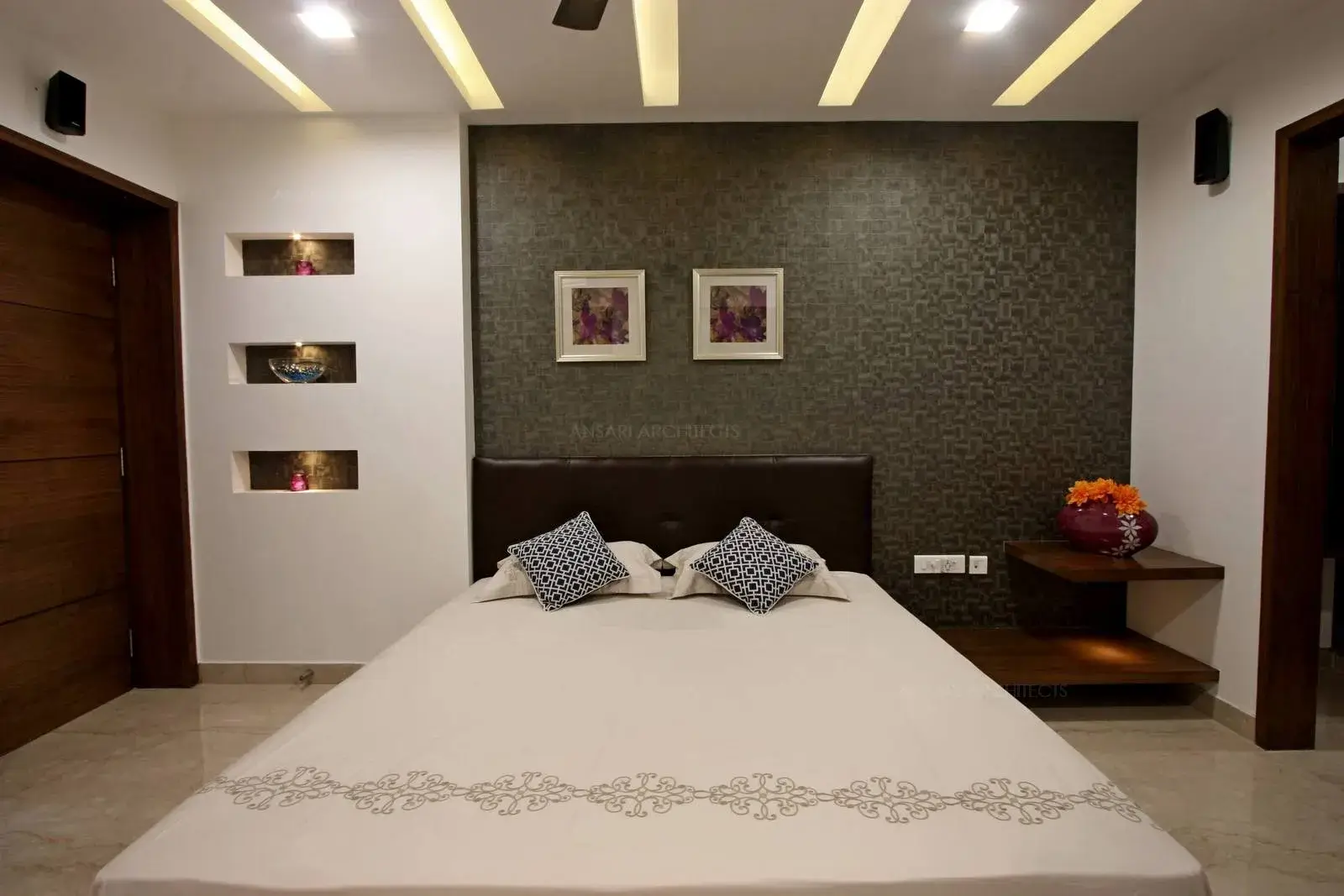 The bedroom space is highlighted with selected use of wallpapers with light colours which creates a sense of serenity to the space with sleek and slender furnishings which are eclectic for the space. The furnishings remain subtle for the bedroom area.
