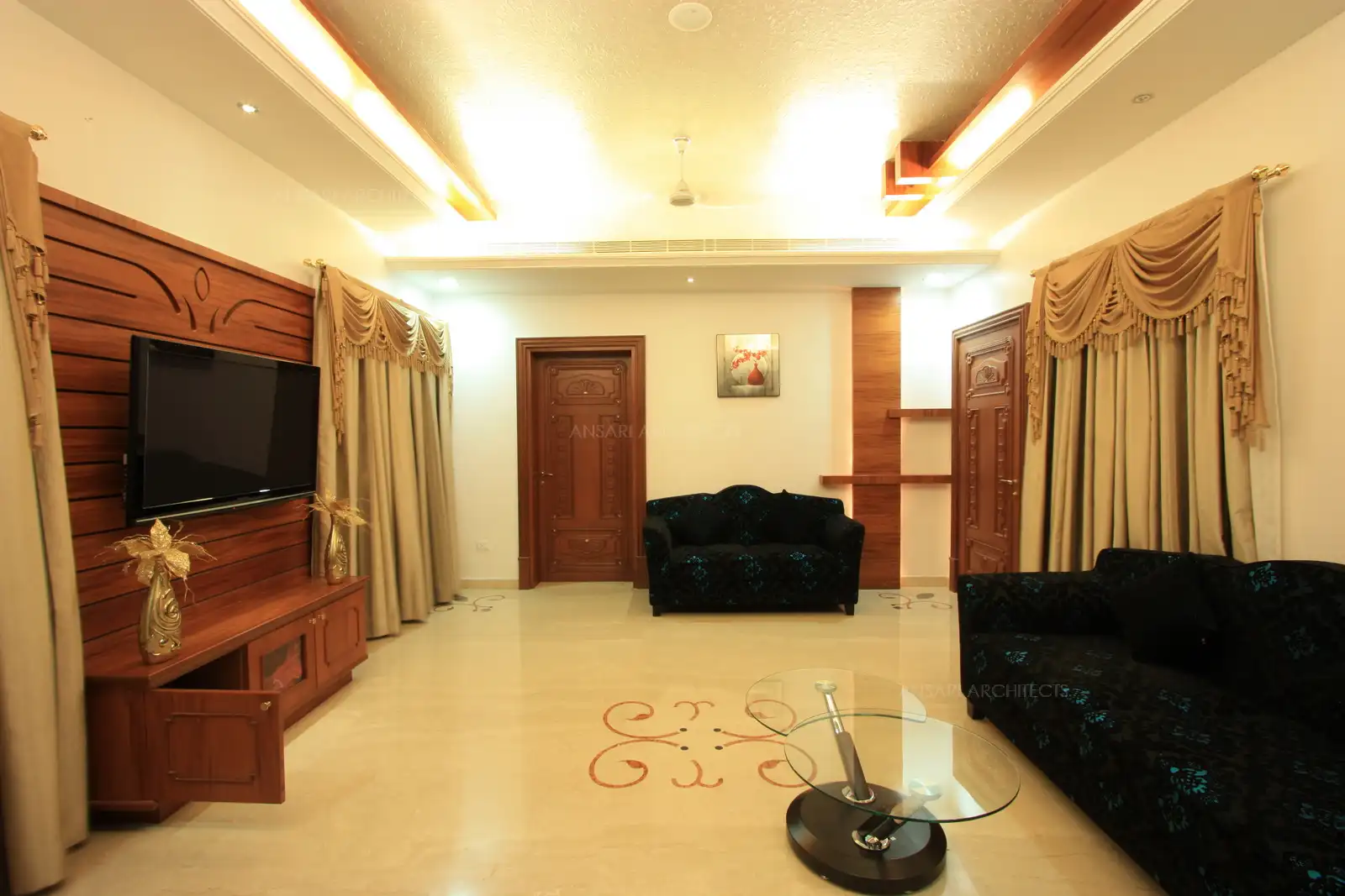 Ladies living has been designed in opulant furniture and curtains to give royal look to the interiors.