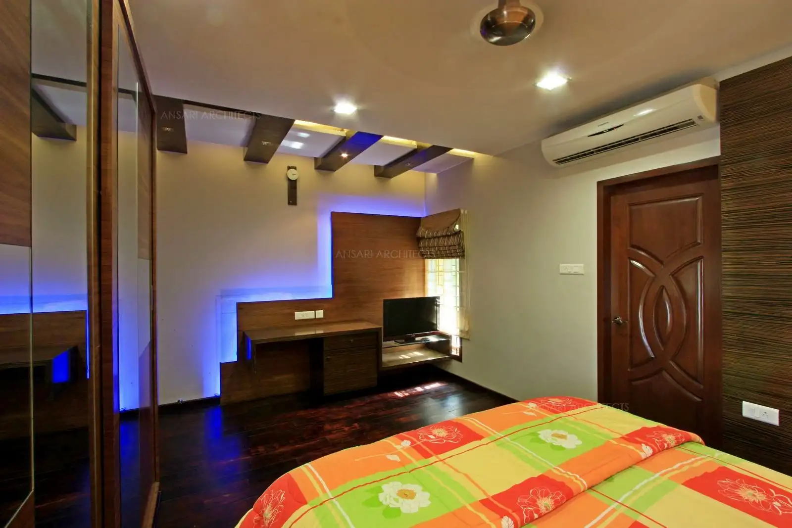 T.V unit in bedroom-4 extends to a study table at different level for a continues sleek look.