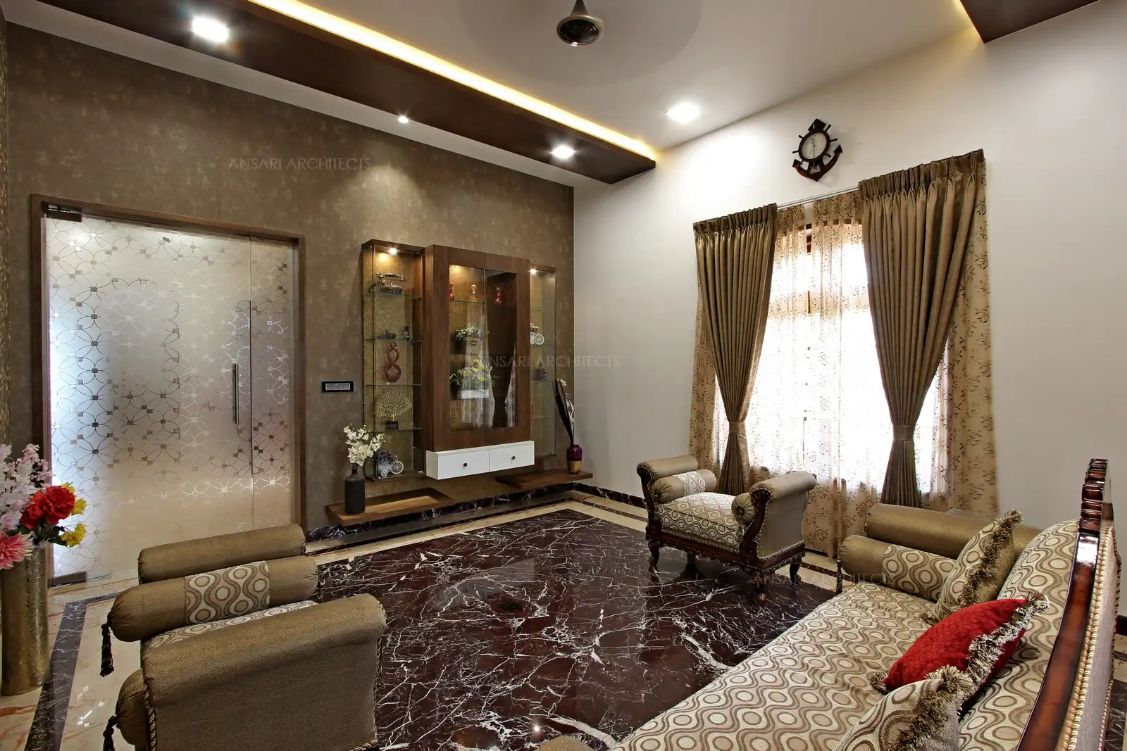 The choice of fabrics , The layering of browns and the composure of this space makes a perfect reception space.