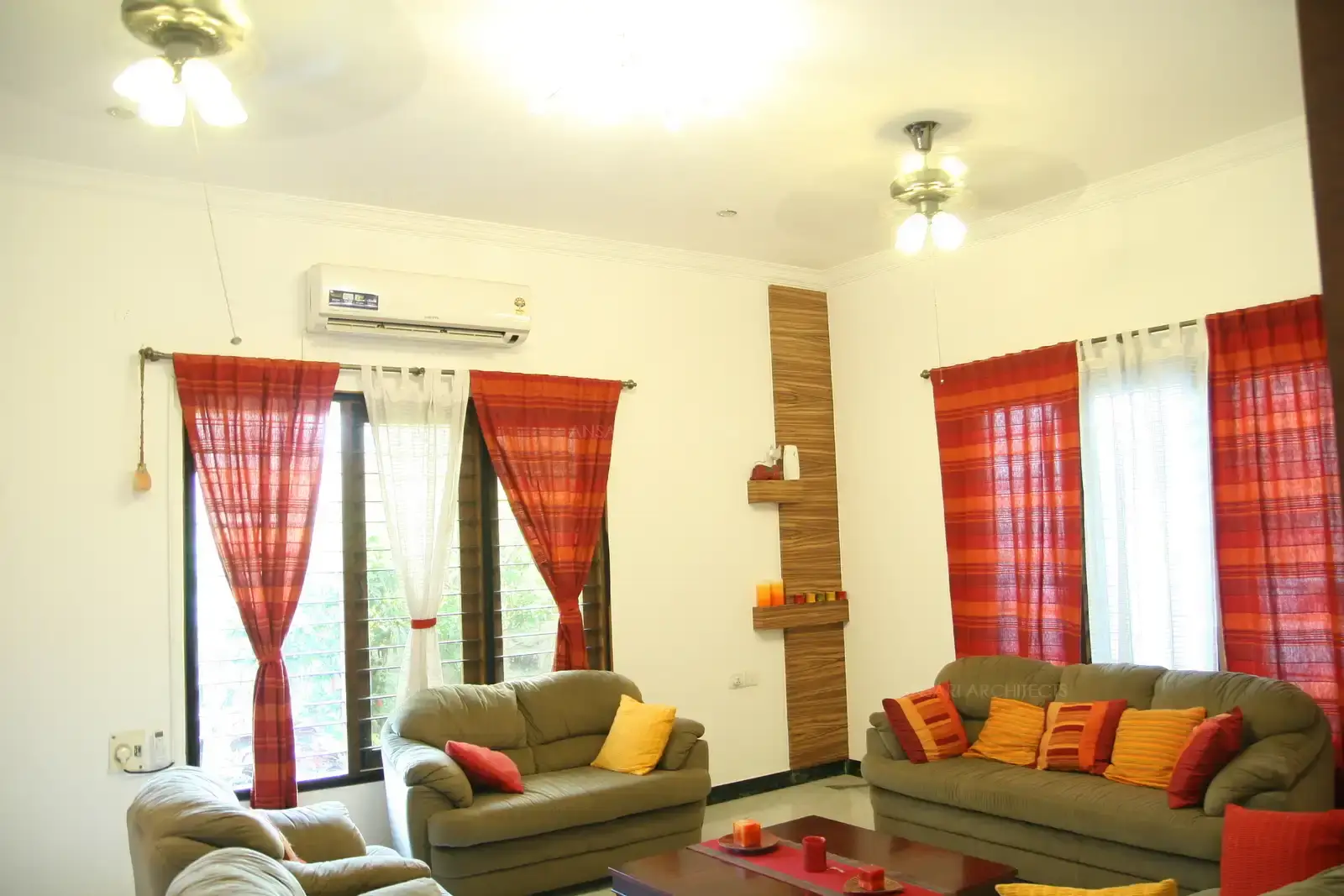Interiors of the living room is designed with simple furnitures and well selected furnishings for a bright and vibrant look.