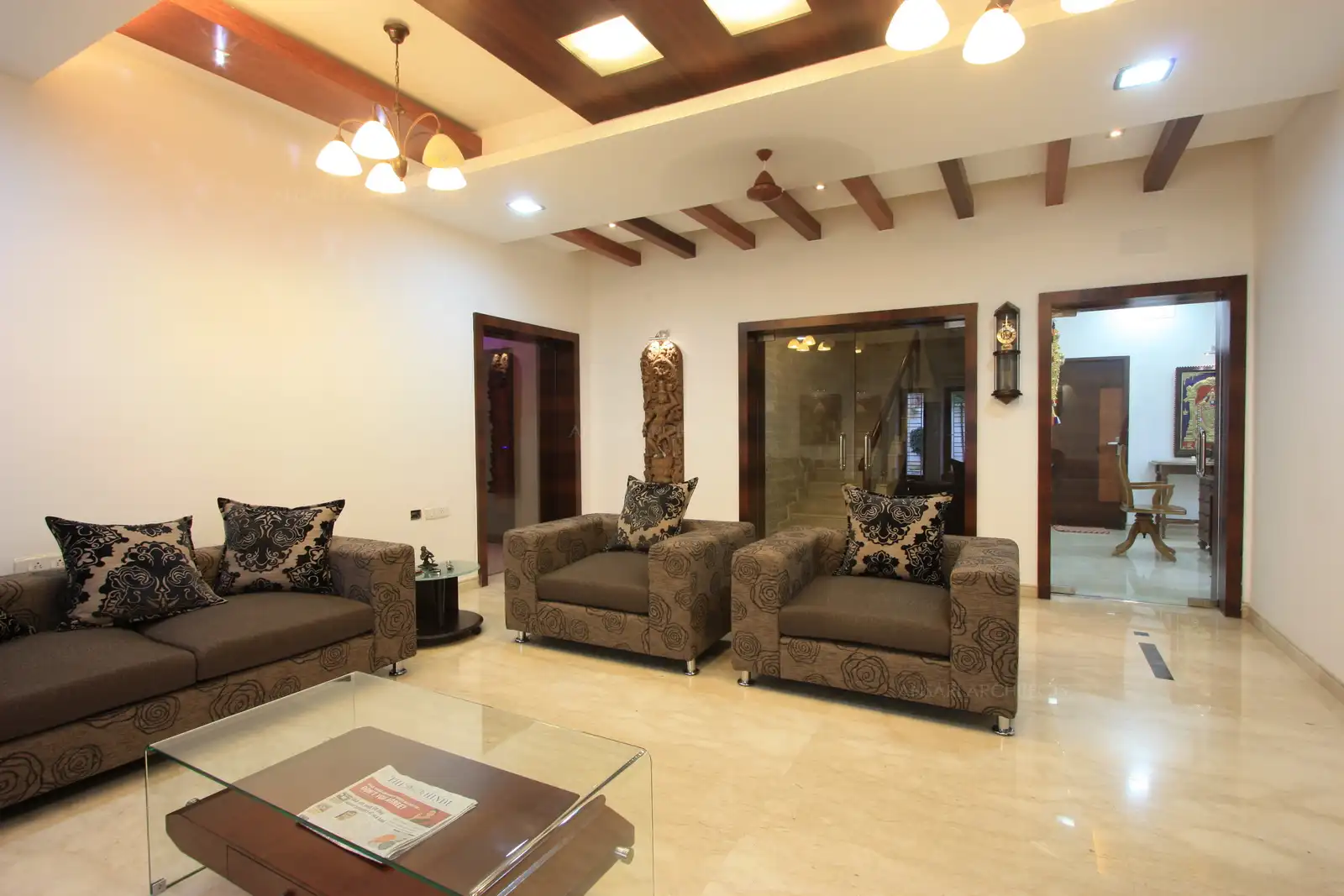 The grand living room retains is old charm with wooden rafters, echoing the erstwhile era. And the furniture in contemporary design add a touch of latest style.