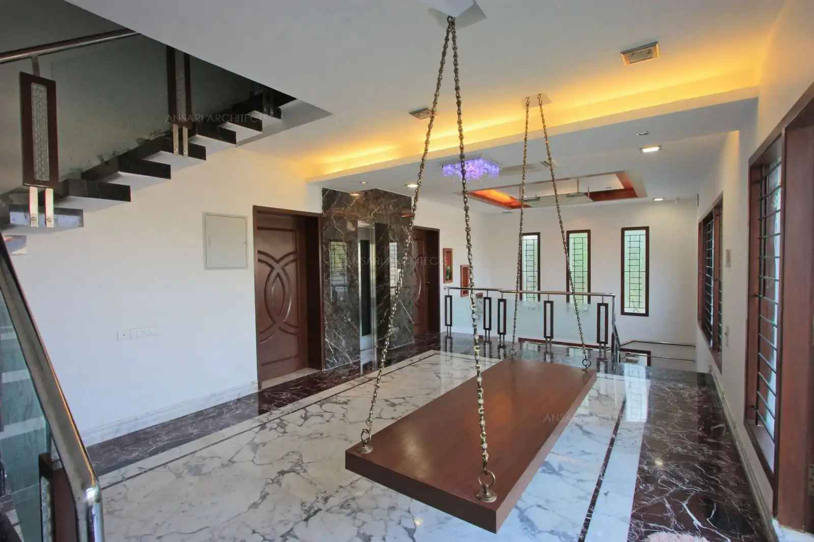 The common area in the second floor is provided with wooden swing rather than formal seating.