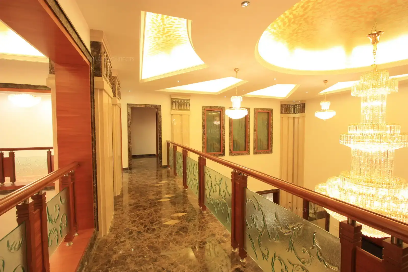 View of passage in the first floor which over looks the grand living area on side and lobby on the other.