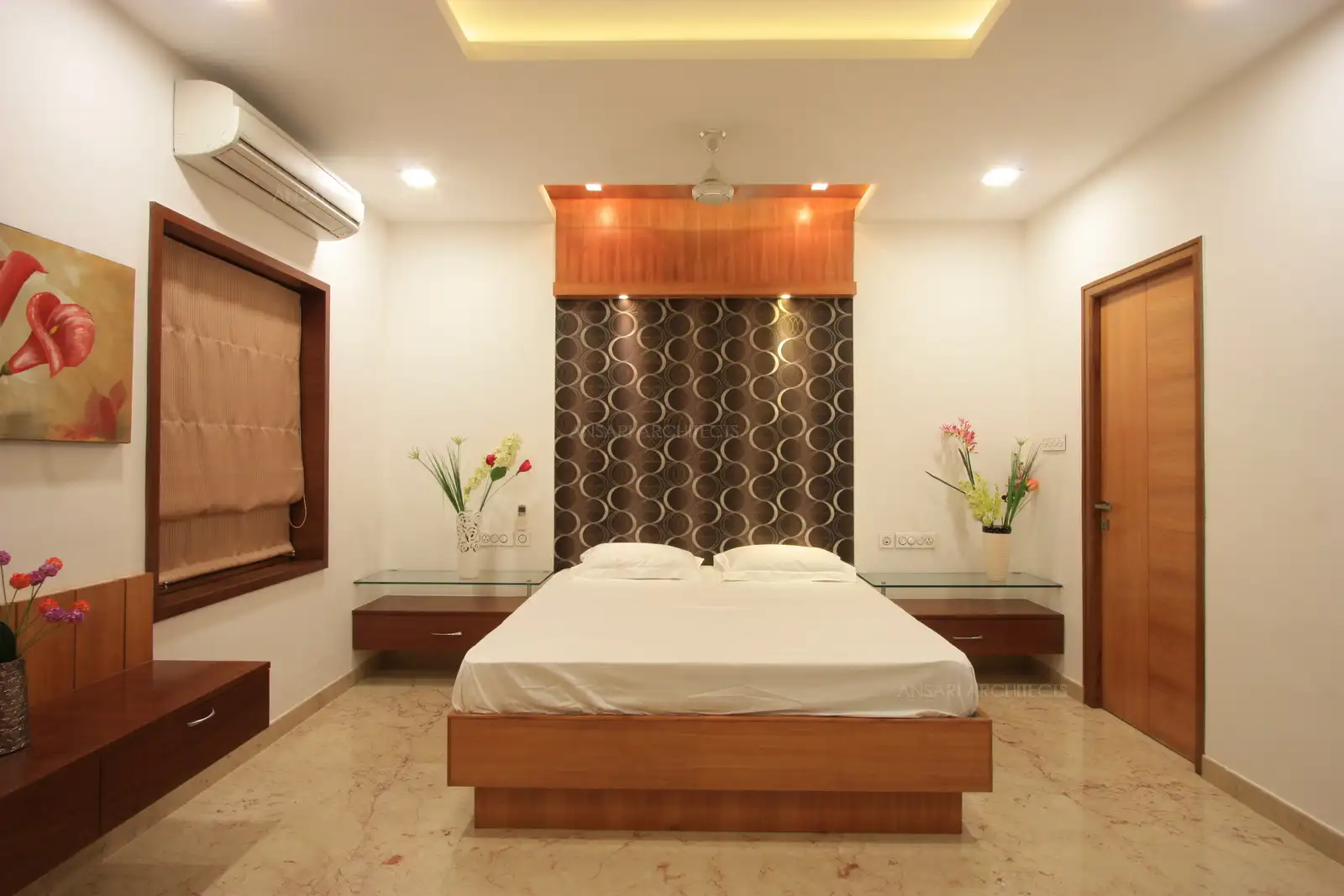 Bedroom 5 in the first floor has highlighting wall on the bedside with bold wall paper pattern.