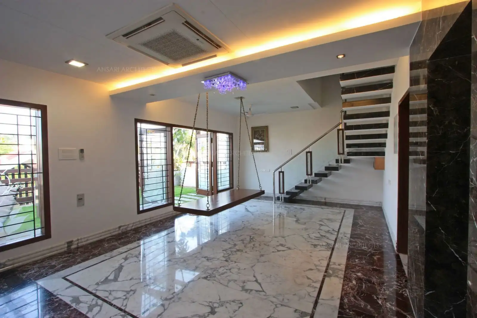 The informal swing in the second floor and terrace garden makes this a perfect family area.