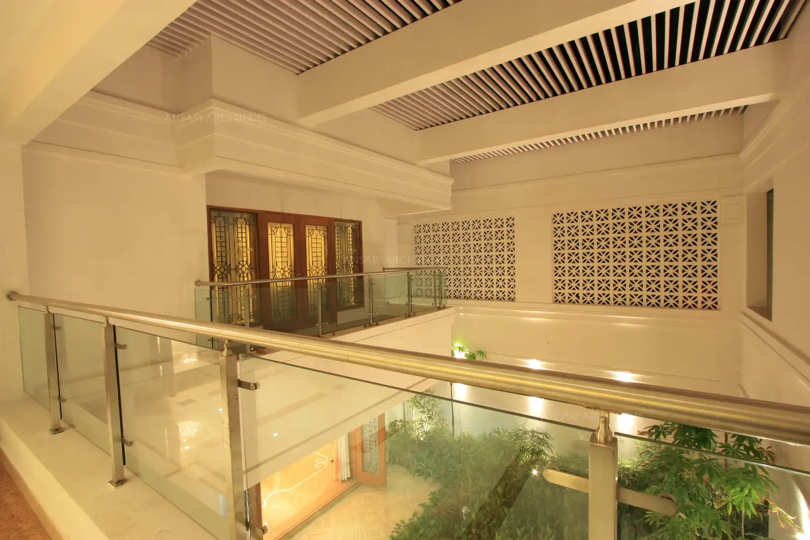 Courtyard has been designed with pergolas for security at second floor level and intricate floral jaali work.