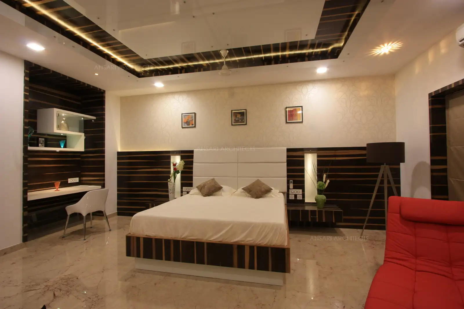 Wall paper behind the bed and high backrest gives a royal look to this bedroom 5.