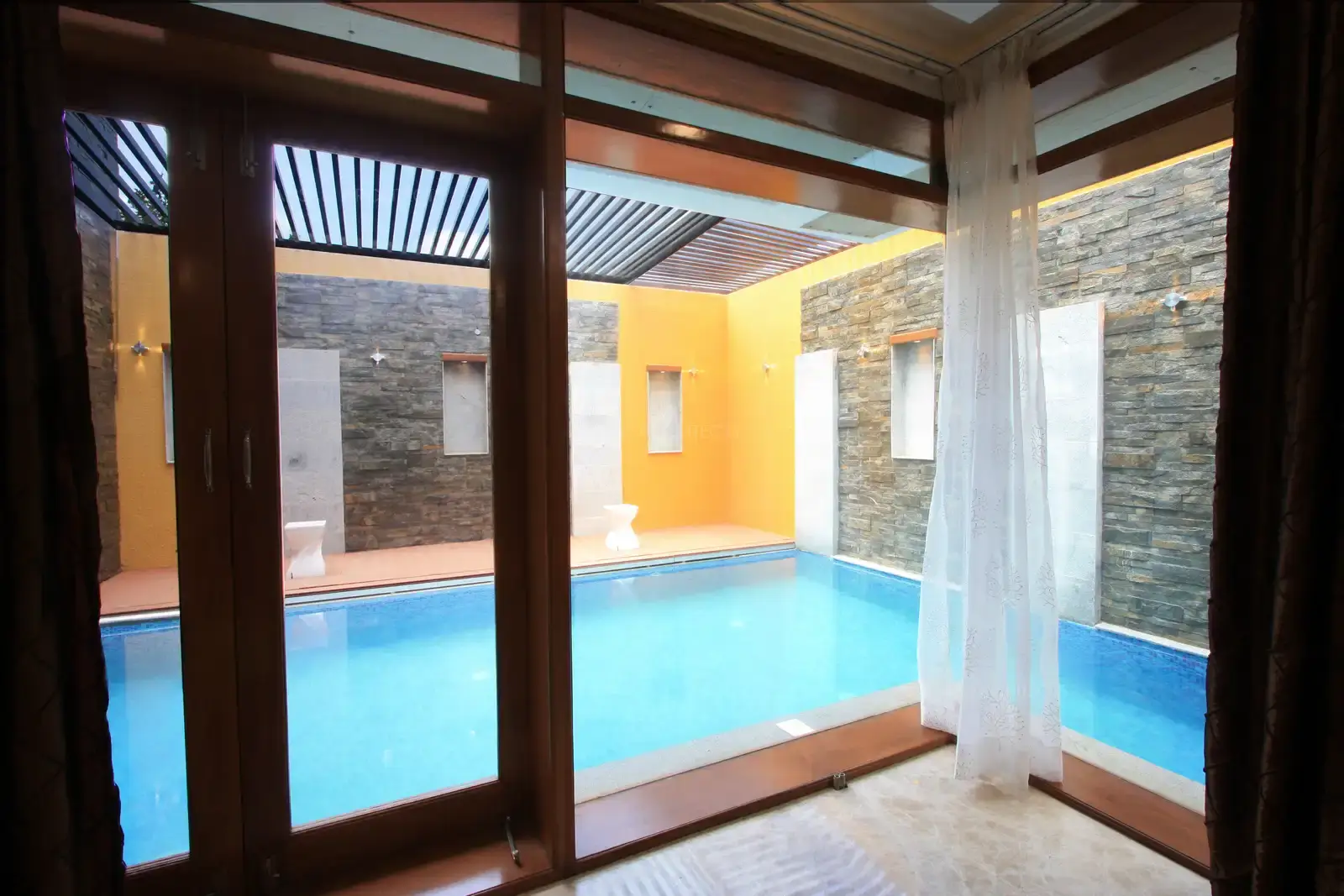 Floating Drawing room in the ground floor showing the water body through full height clear glass.