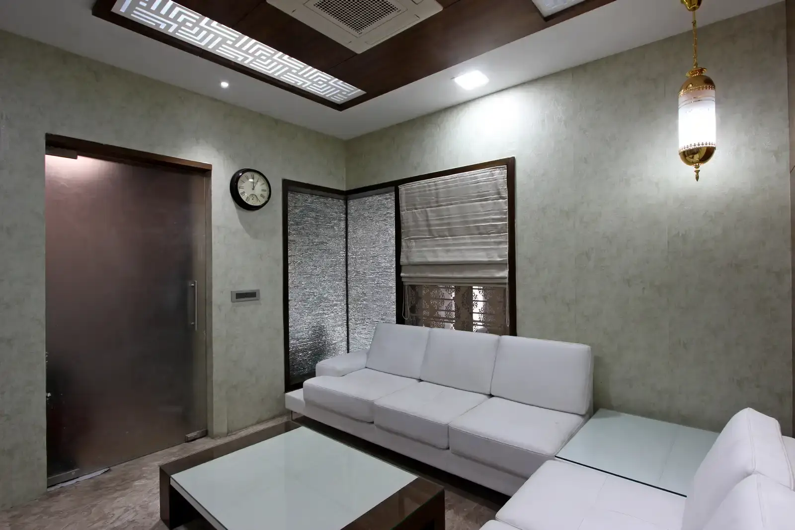 The space is complemented by light fixture of hanging gold pendants enhanced with furnitures and glass doors provide a feminine look