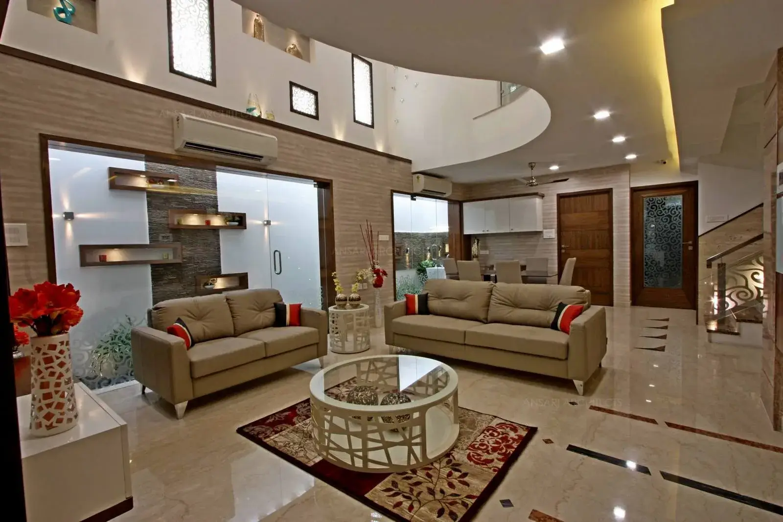 Fixed glass provides natural light and attracts aesthetically giving an appeal. The white walls wrapped with veneer finishes at every part of the area creates a unique character for the living. 