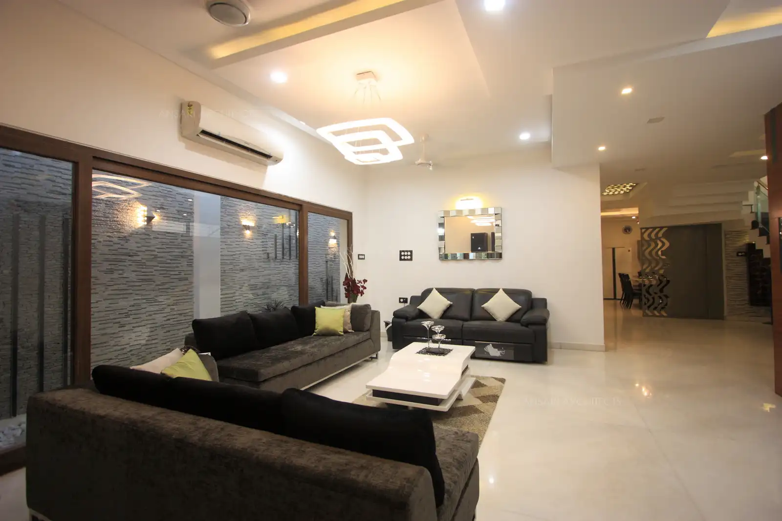 Decorative lighting and selective use of furnitures and furnishings adds up to the simplicity of the decor in the living room.