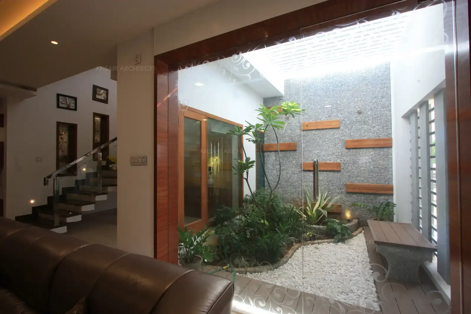 View of courtyard from the living which extends up to second floor.