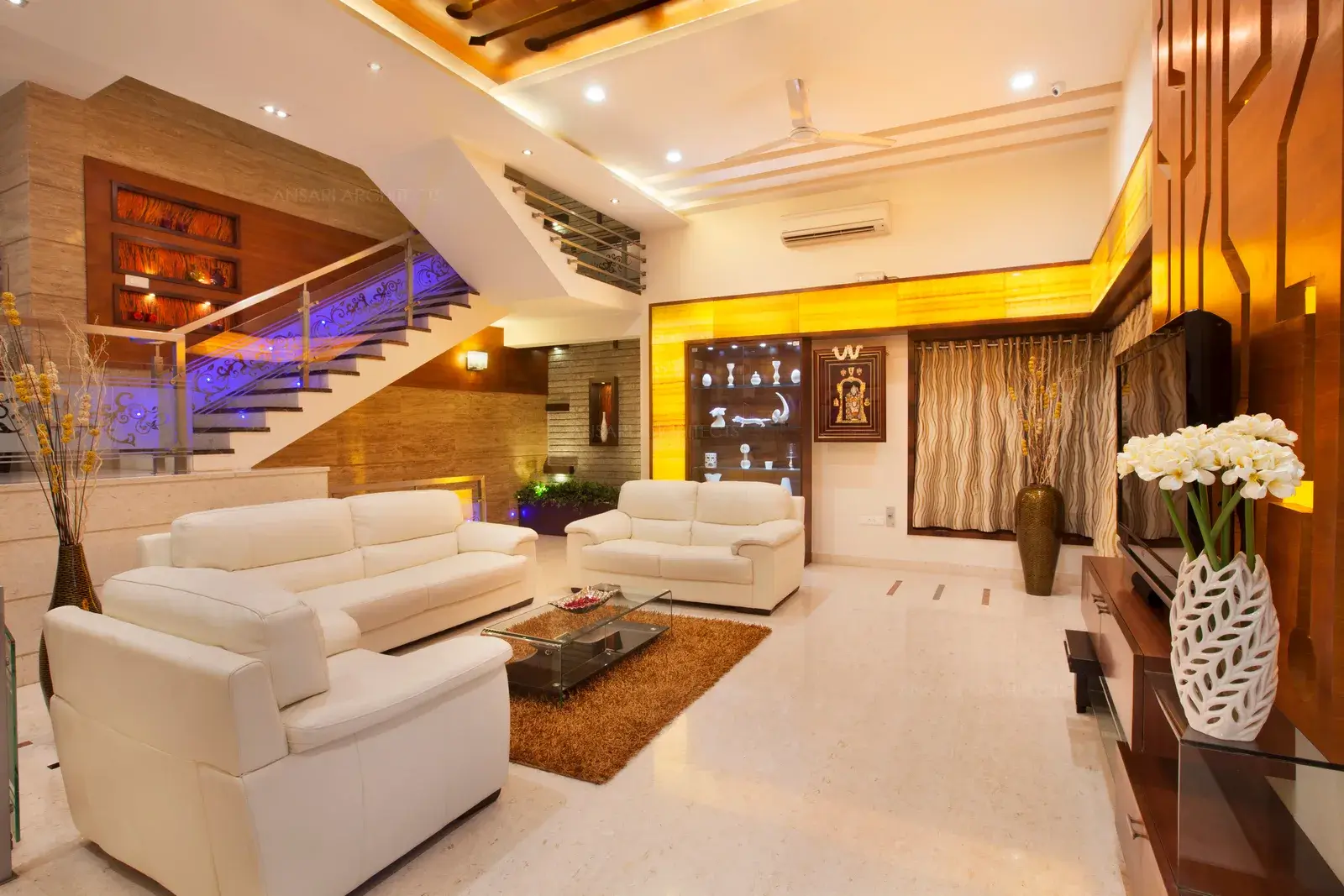 Use of Onyx marble in the spacious living room highlights the display area.