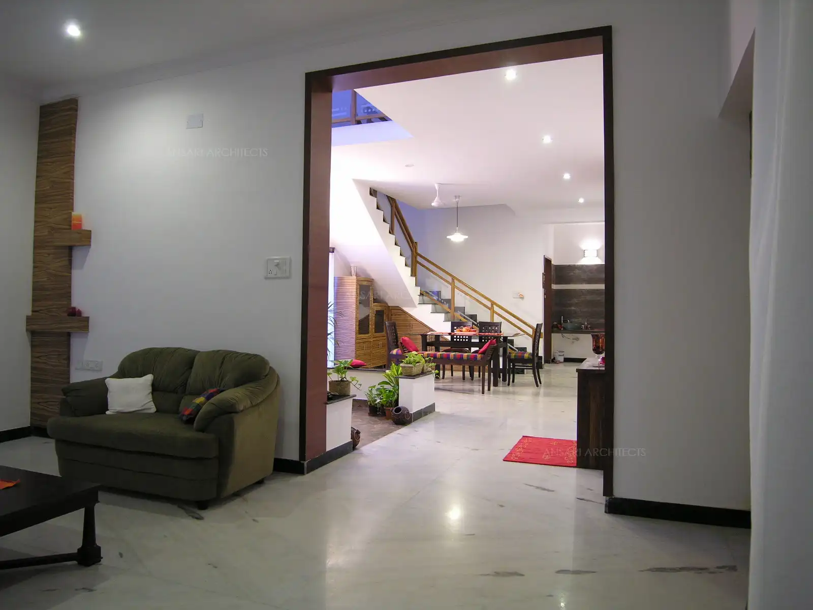 Opening leading to dining area from the living has been covered with wood panelling for easy maintenance.