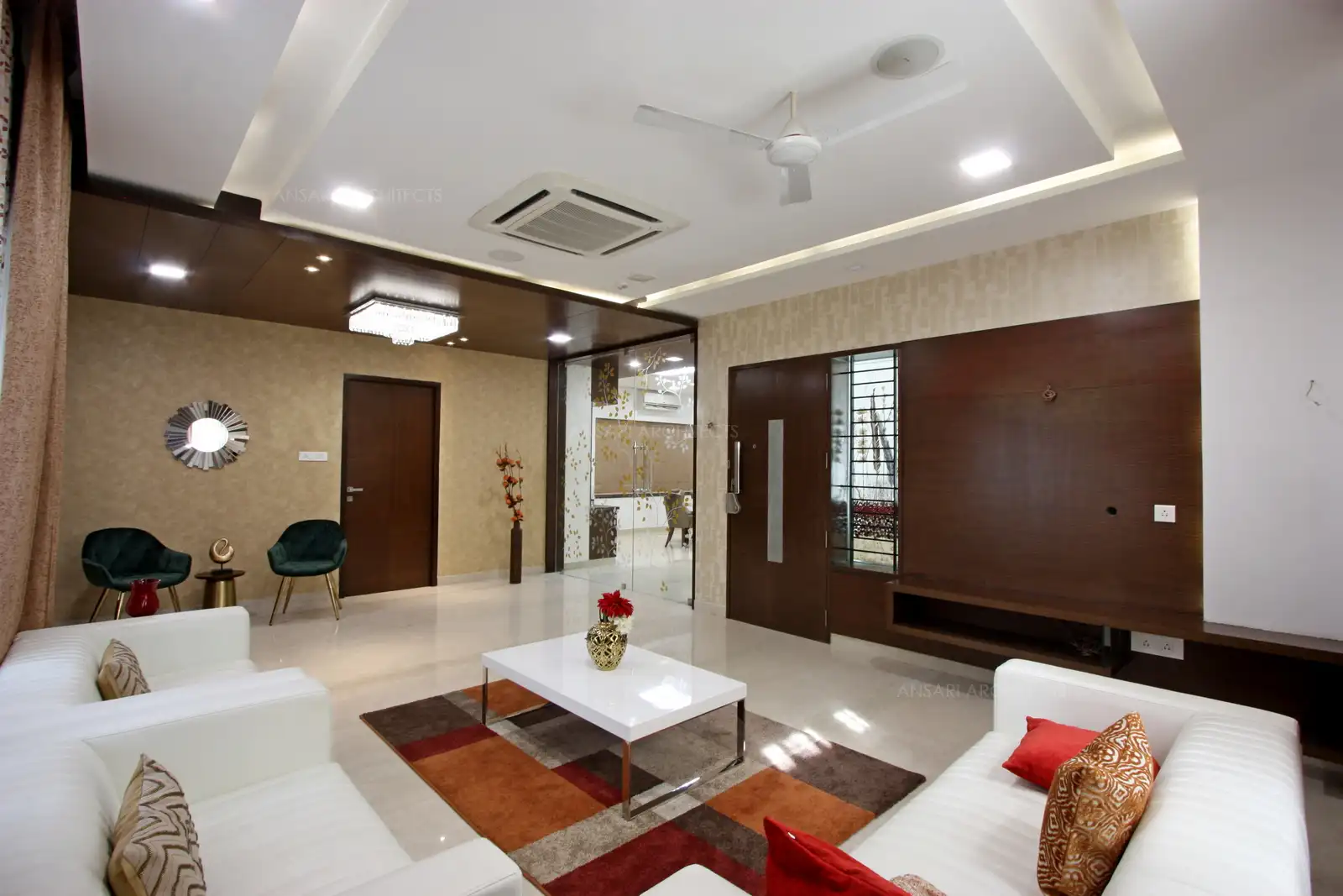 The simple and ergonomic wood work provided for the living area provides elegance to the house.