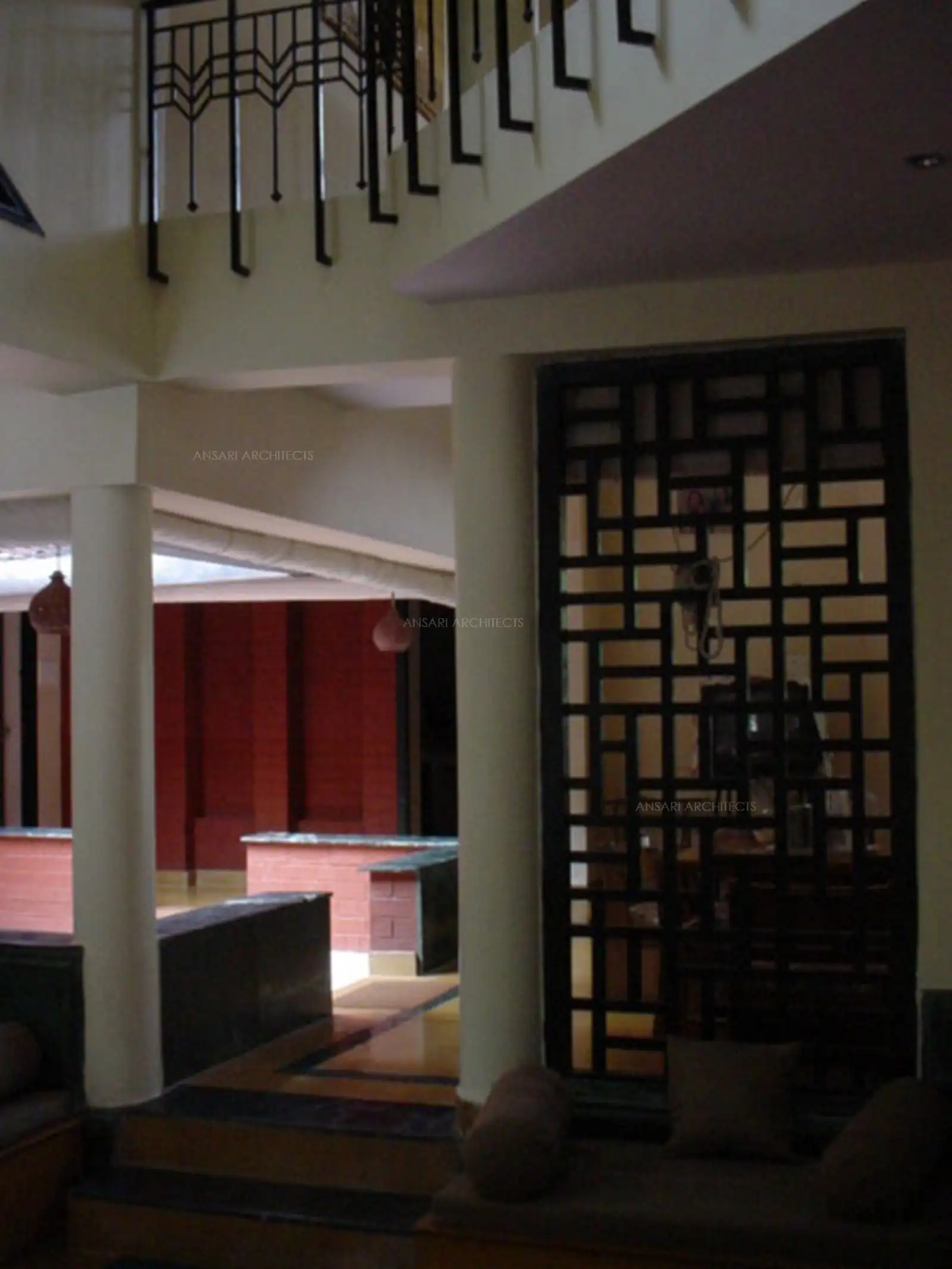 Wooden trellis used as a partition for traditional look.