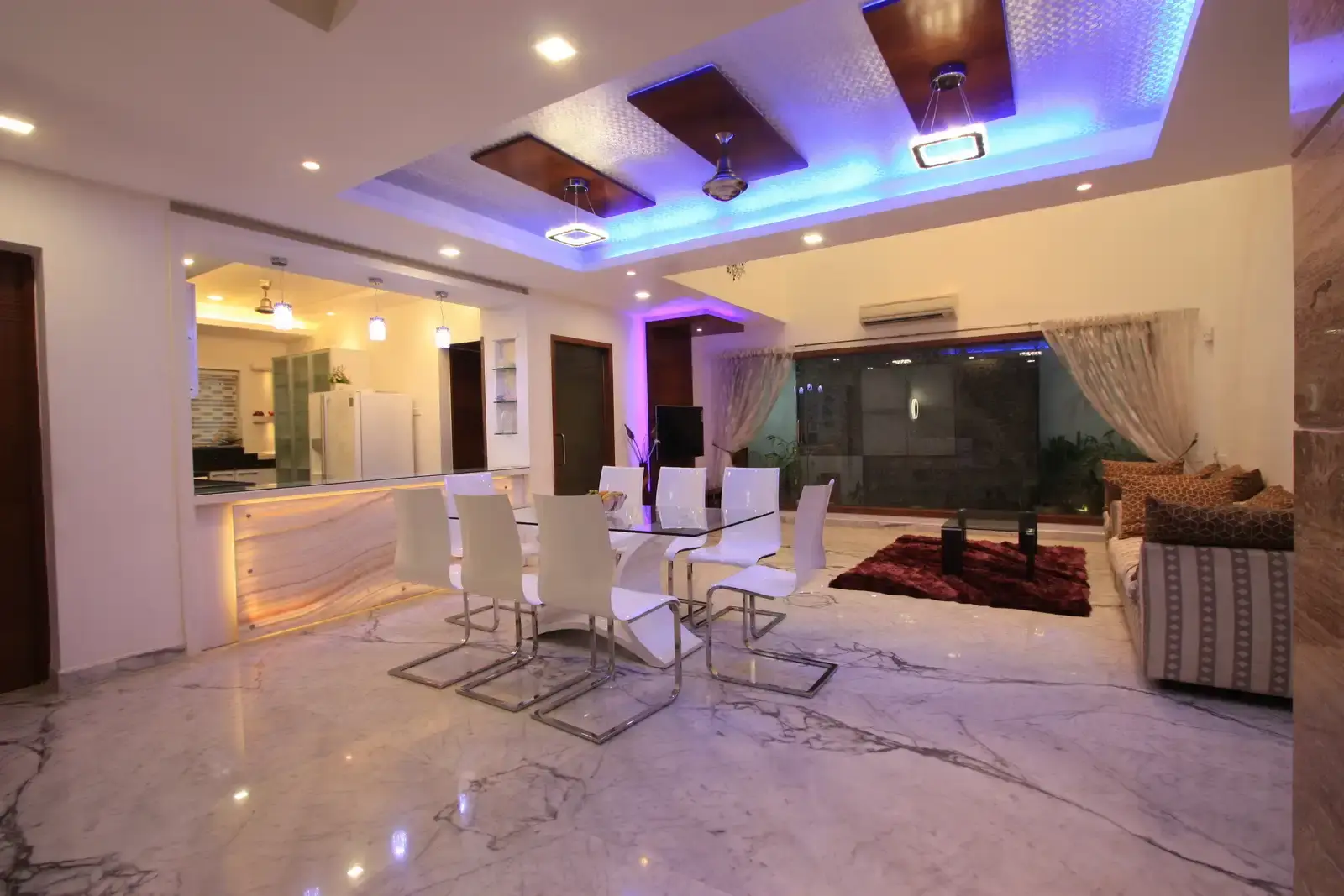 Full length clear glass has been designed in the living room for view of the courtyard which makes the area very spacious and open.