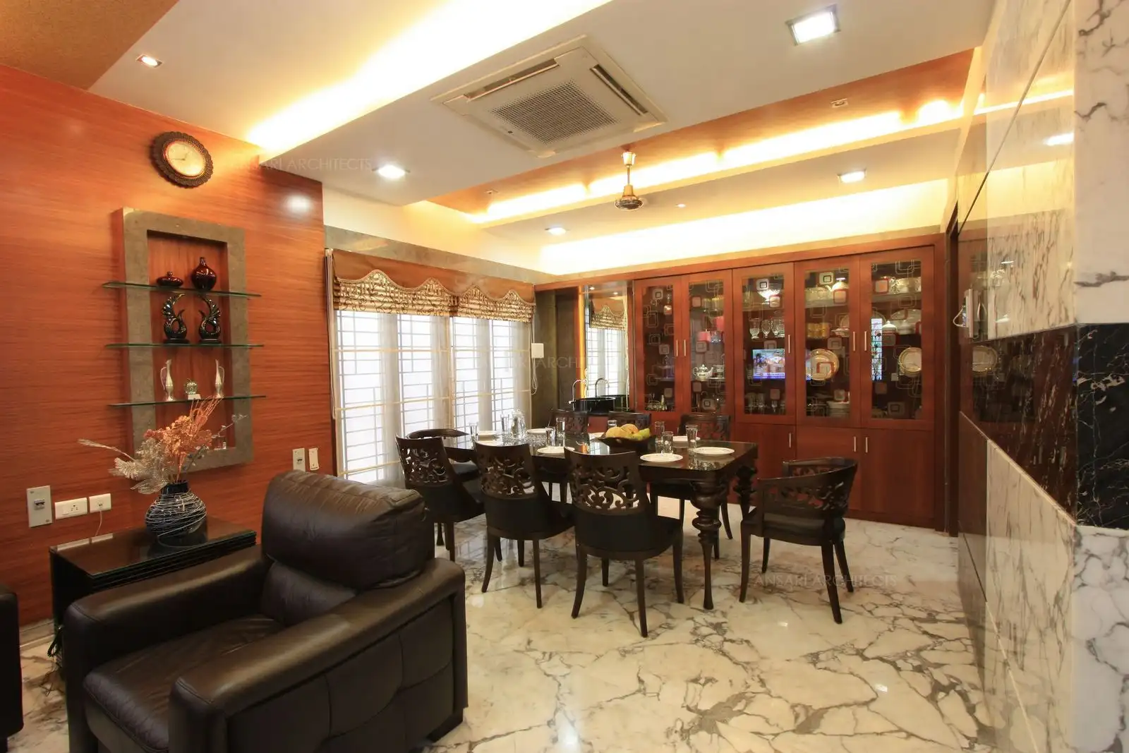 View of dining room Interior design showing the crockery unit and dining area.