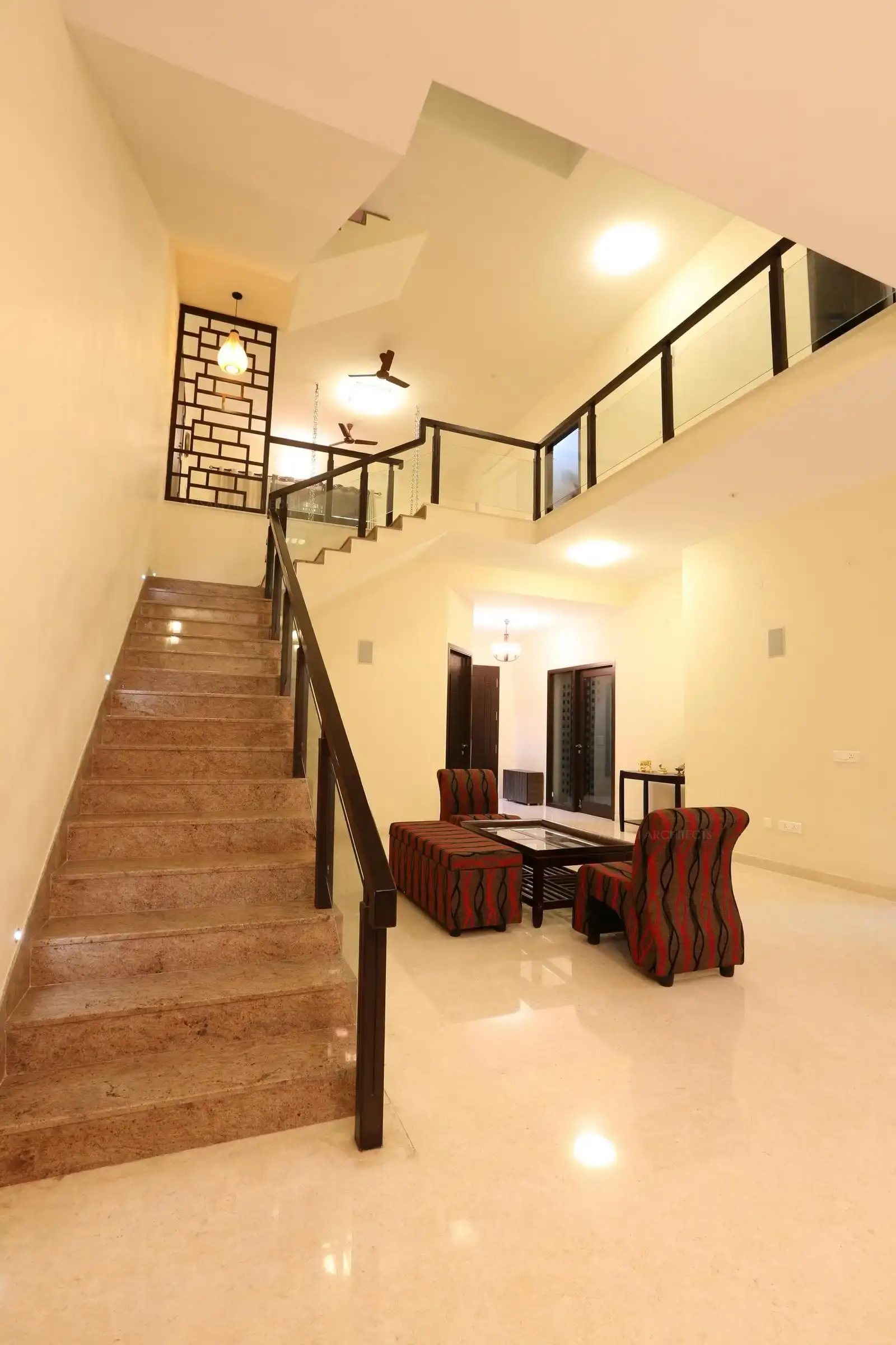 Bright and spacious living room and staircase area.