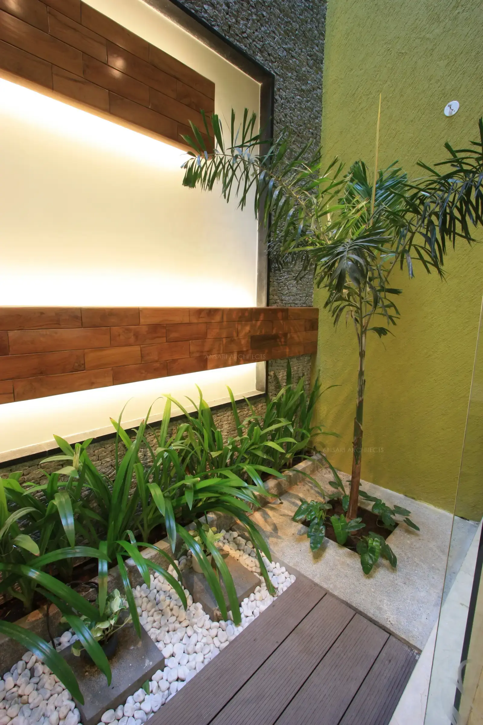 Courtyard in the dining room with a combination of wooden,stone and pebble flooring.