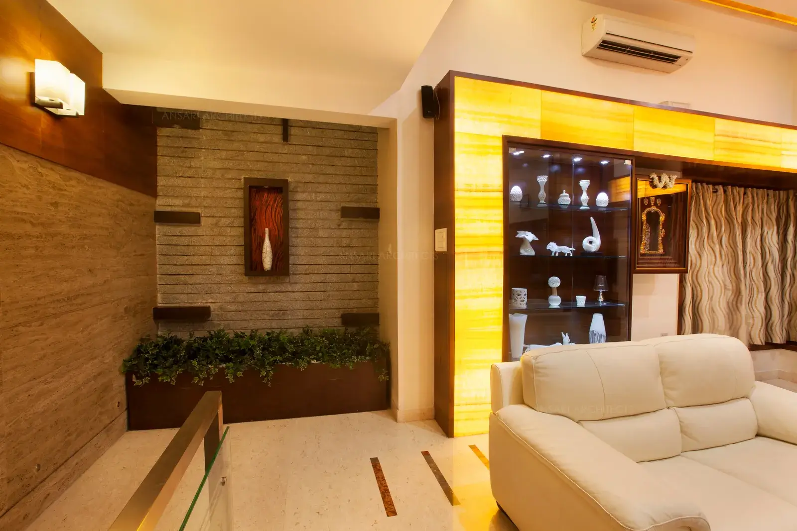 Courtyard in the living room extents up to third floor highlighting the staircase area.