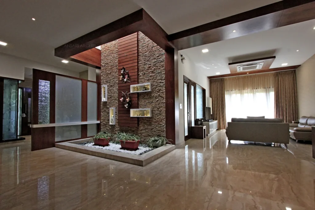 a room with a stone wall and a couch