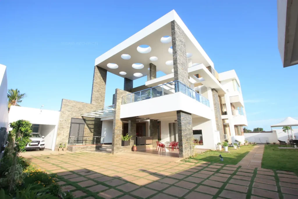 a building with a patio and a lawn