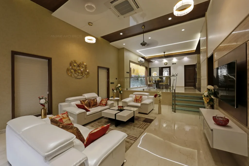 a room with white furniture and a staircase