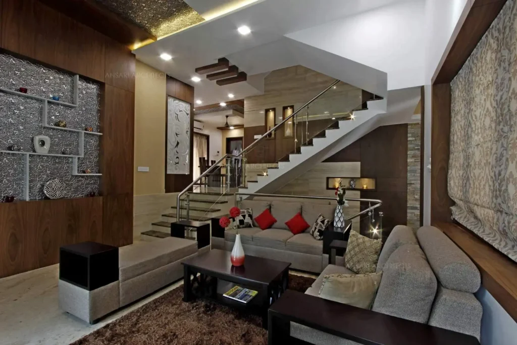 a living room with a staircase and couch