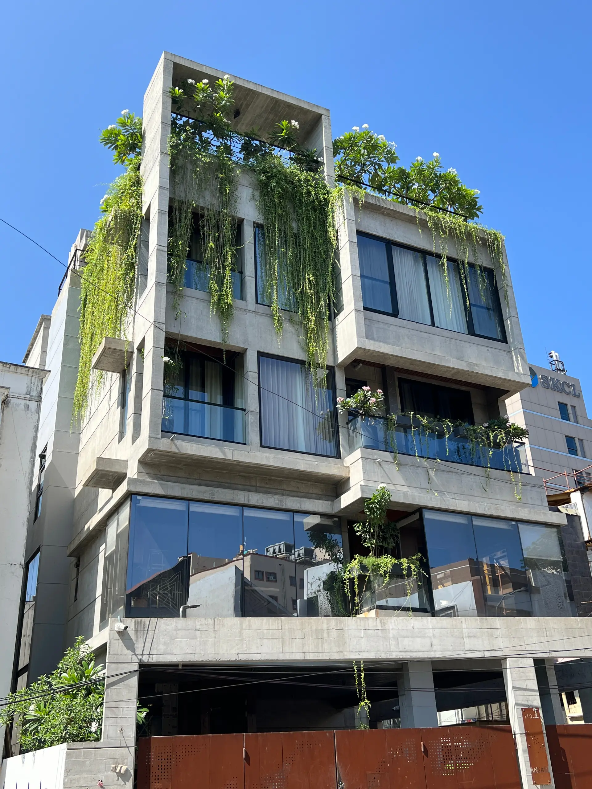 a building with plants on the roof
