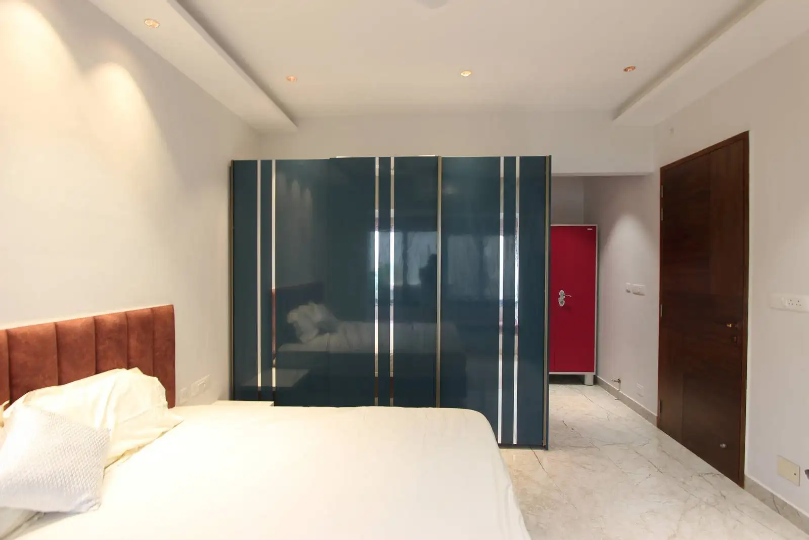 Crisp white walls and ceilings provide a minimalist canvas that highlights the room’s key features.