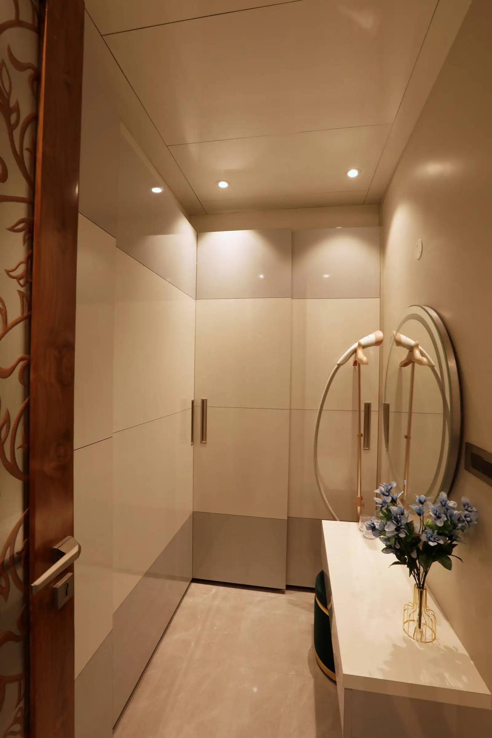 Bright, streamlined dressing room design with smart storage and functional comfort for a clean, elegant interior.