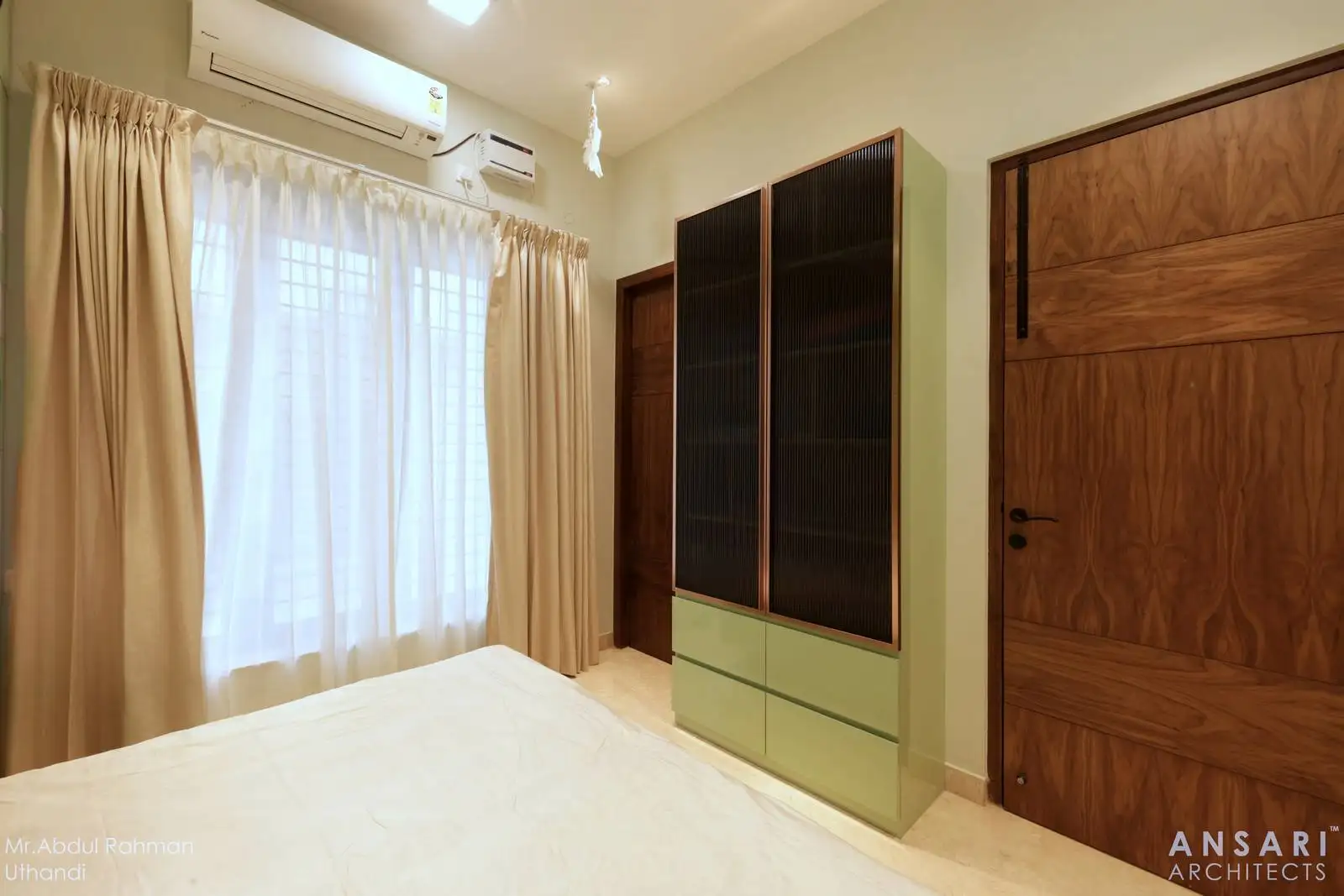 A bright, airy child’s room with two-tone cabinetry, warm wood accents, ample natural light, and comfortable climate control.