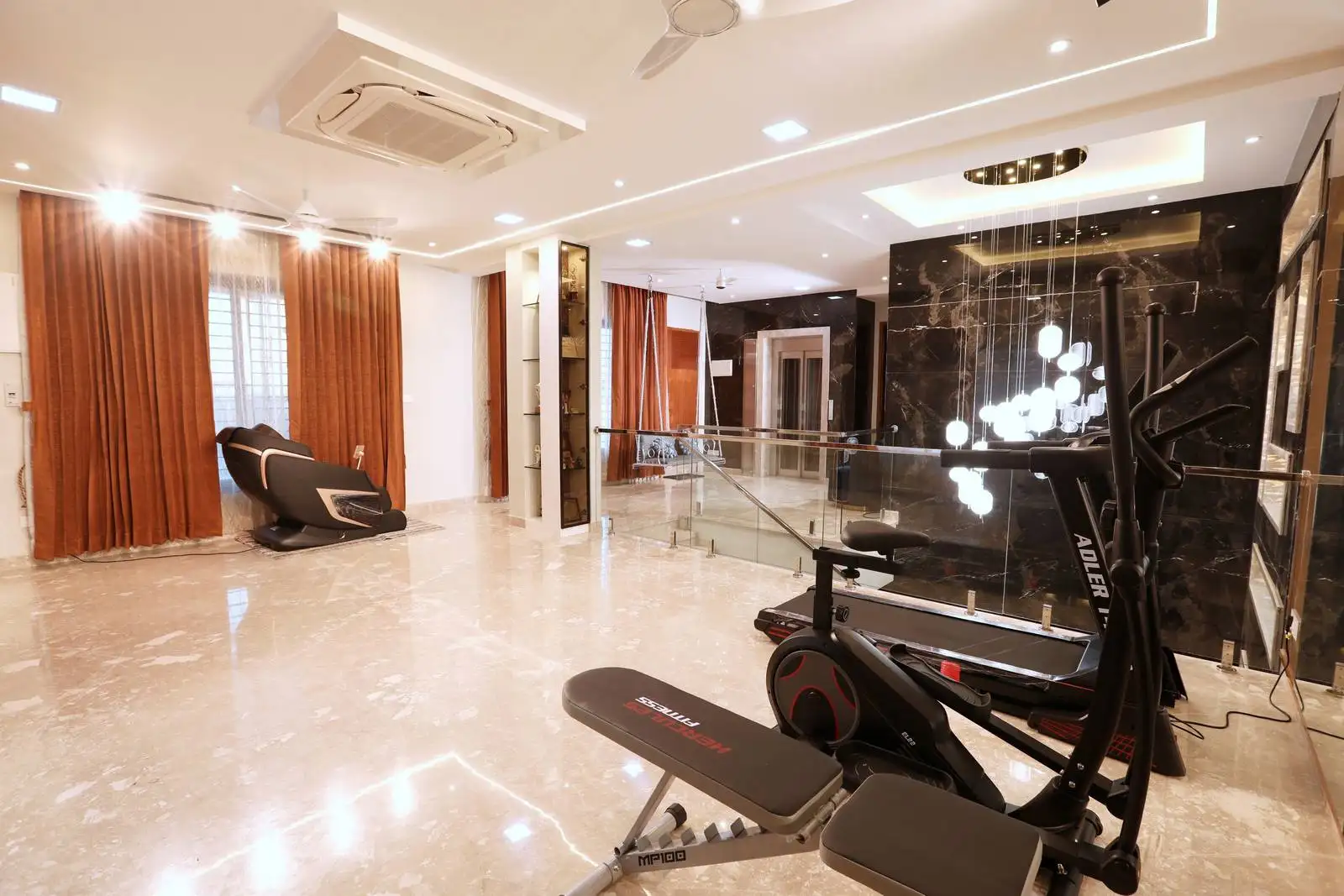 Second floor floor home gym designed with sleek black marble accents, glossy tiled flooring, and layered lighting, featuring essential fitness equipment and a relaxing massage chair by large windows with warm brown curtains.