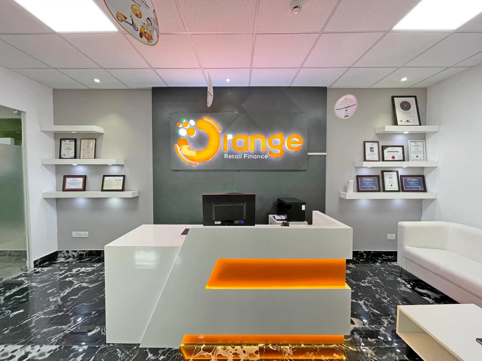 Strategic lighting, floating displays, and ergonomic furnishings enhance visual appeal, comfort, and functional flow.