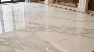 Glossy white marble floor with gray veining and reflections of windows and interior elements.