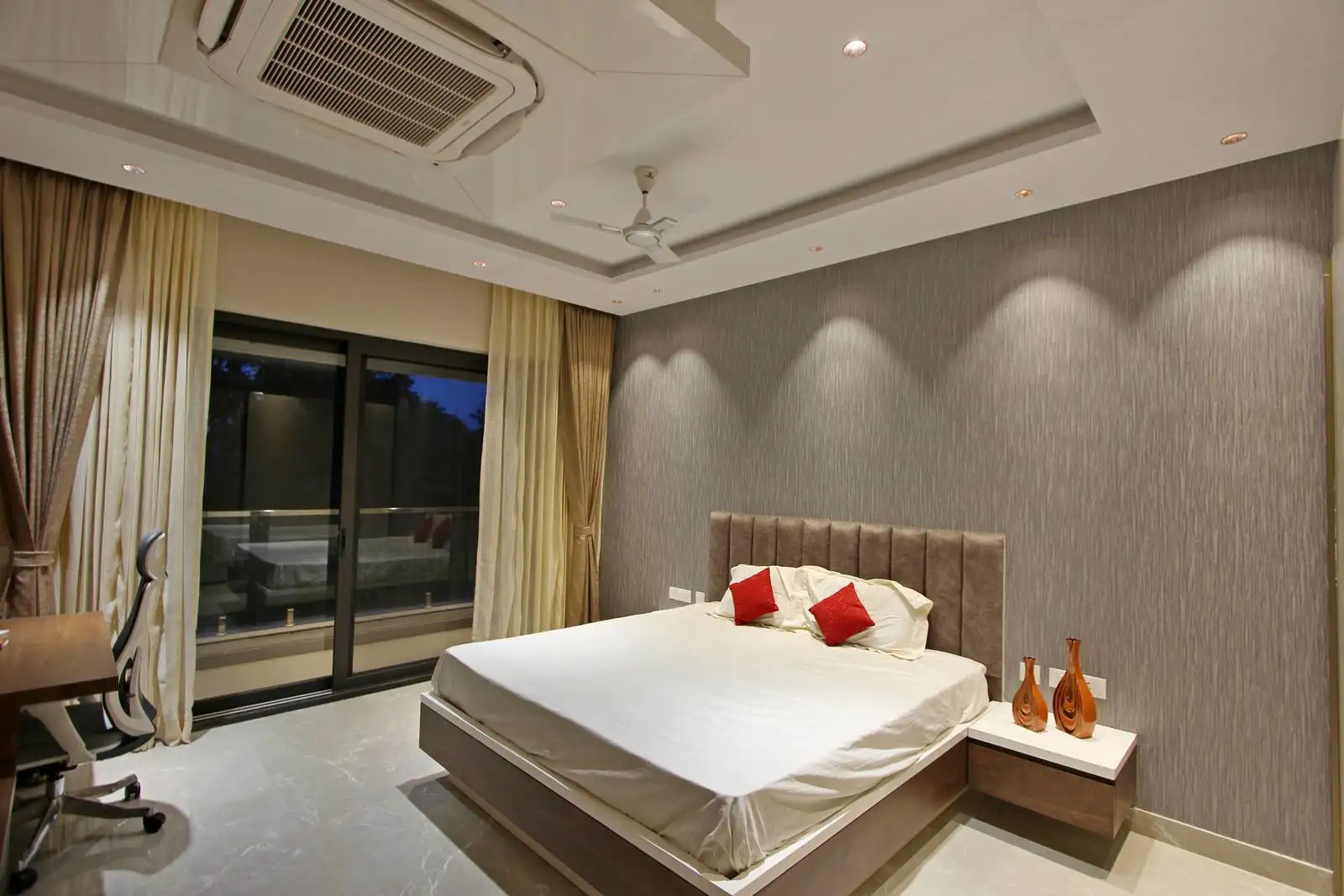  A large, floor-to-ceiling wardrobe with a light, possibly high-gloss, finish is visible.