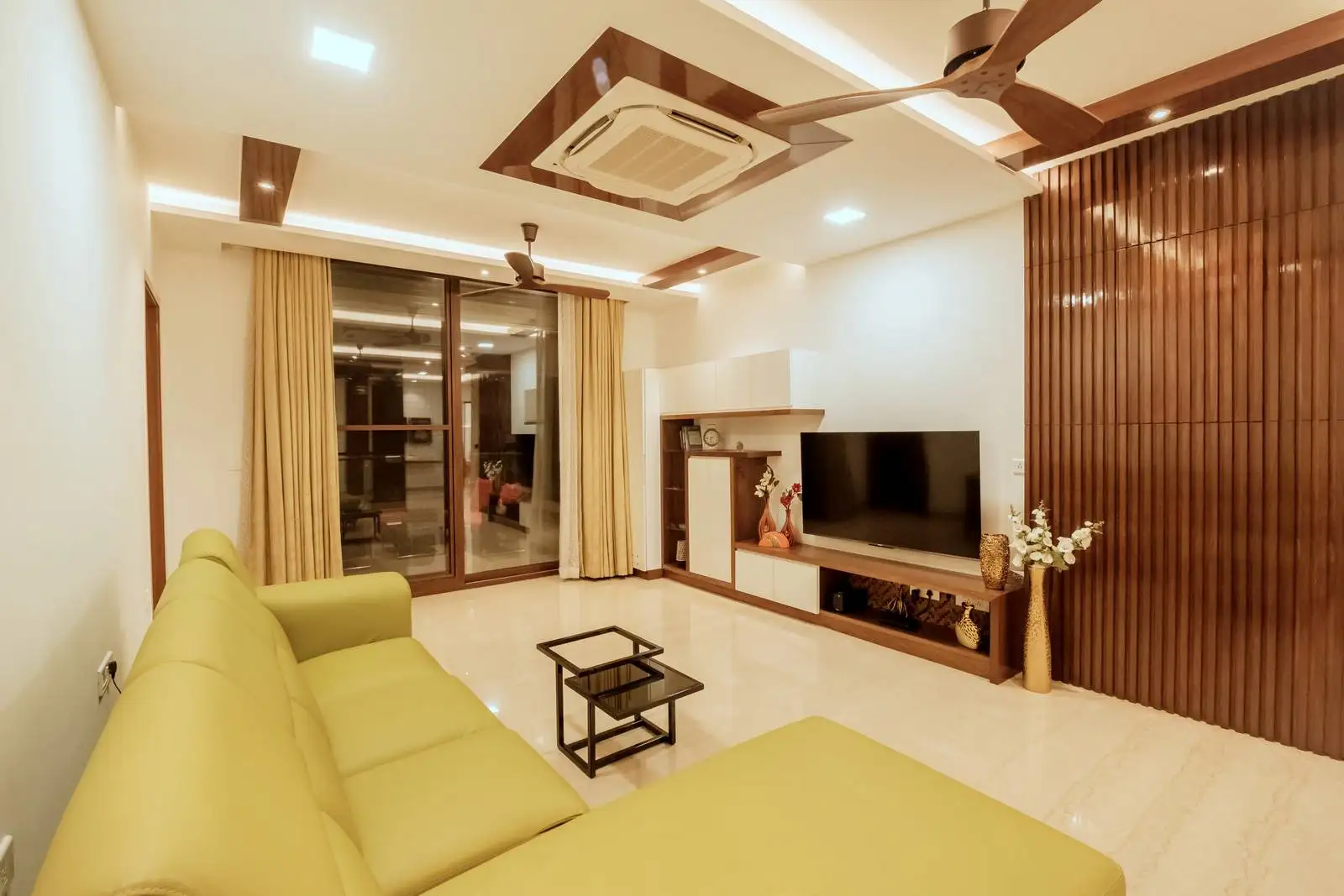 The room features a large, centrally placed sliding glass window/door unit that acts as a focal point for the space.