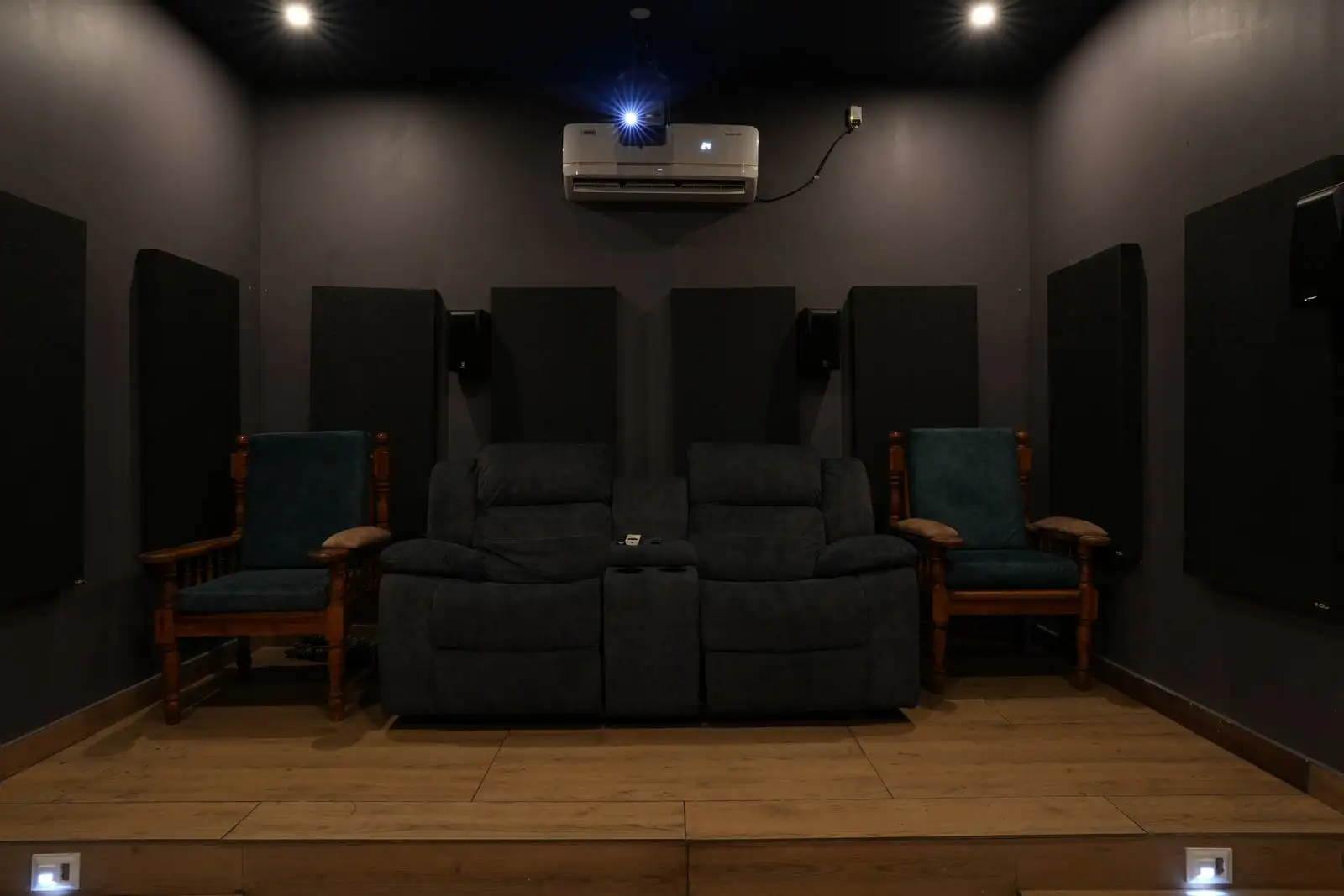 Designed for comfort and superior acoustics with large black acoustic panels to reduce echo and enhance sound quality.
