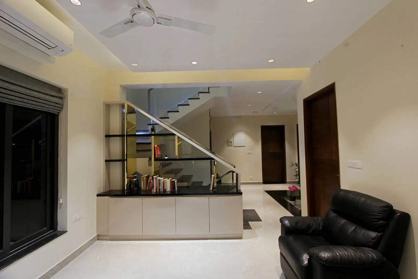 The family area connects seamlessly to the staircase and nearby rooms, creating a central gathering space. Open sightlines promote flow and family interaction.