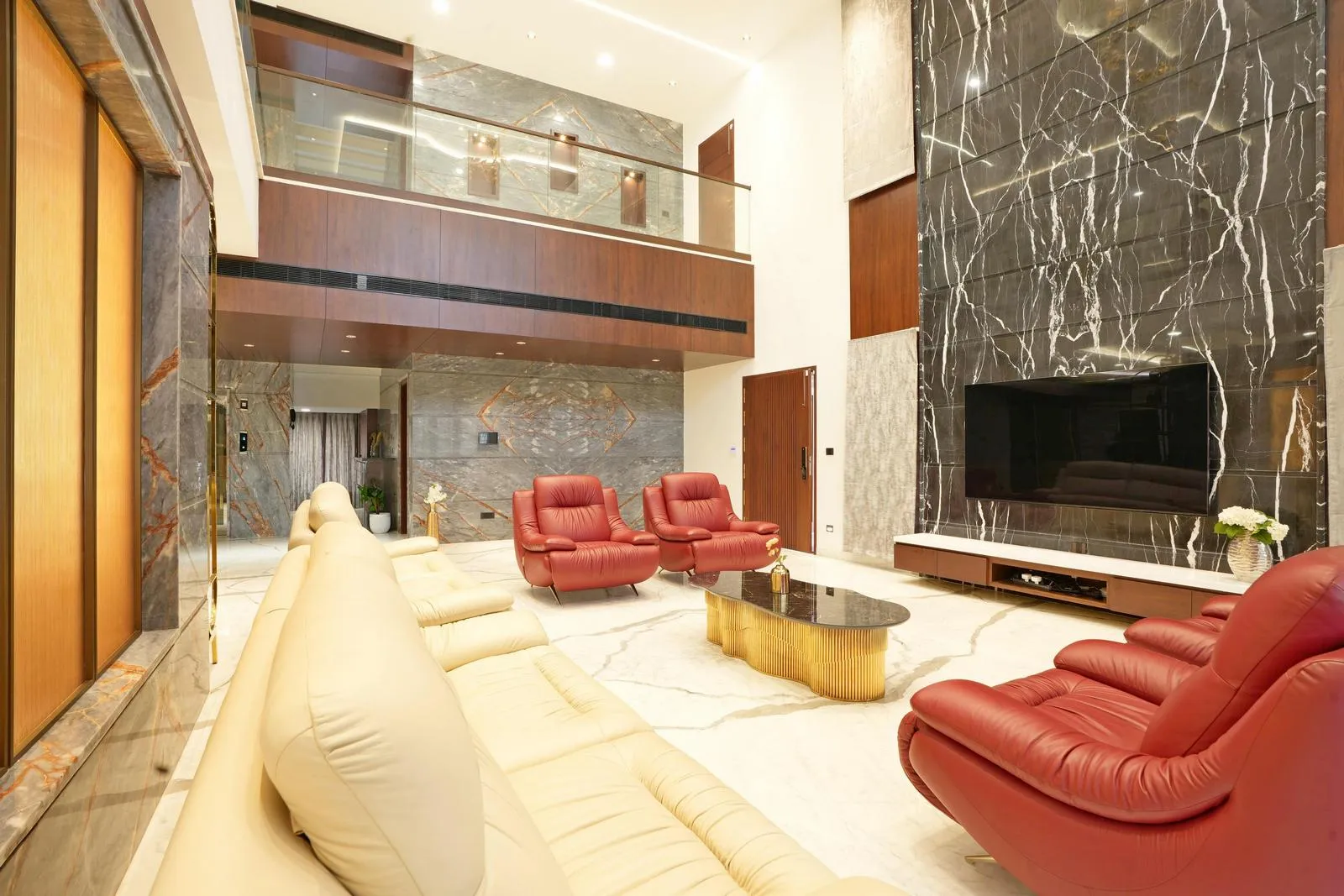 The living area (31'0" x 20'0") features a double-height ceiling and mezzanine balcony, creating openness and visual connection between levels. White marble flooring, a black-veined feature wall, and warm wooden accents combine luxury, elegance, and a balanced modern aesthetic.