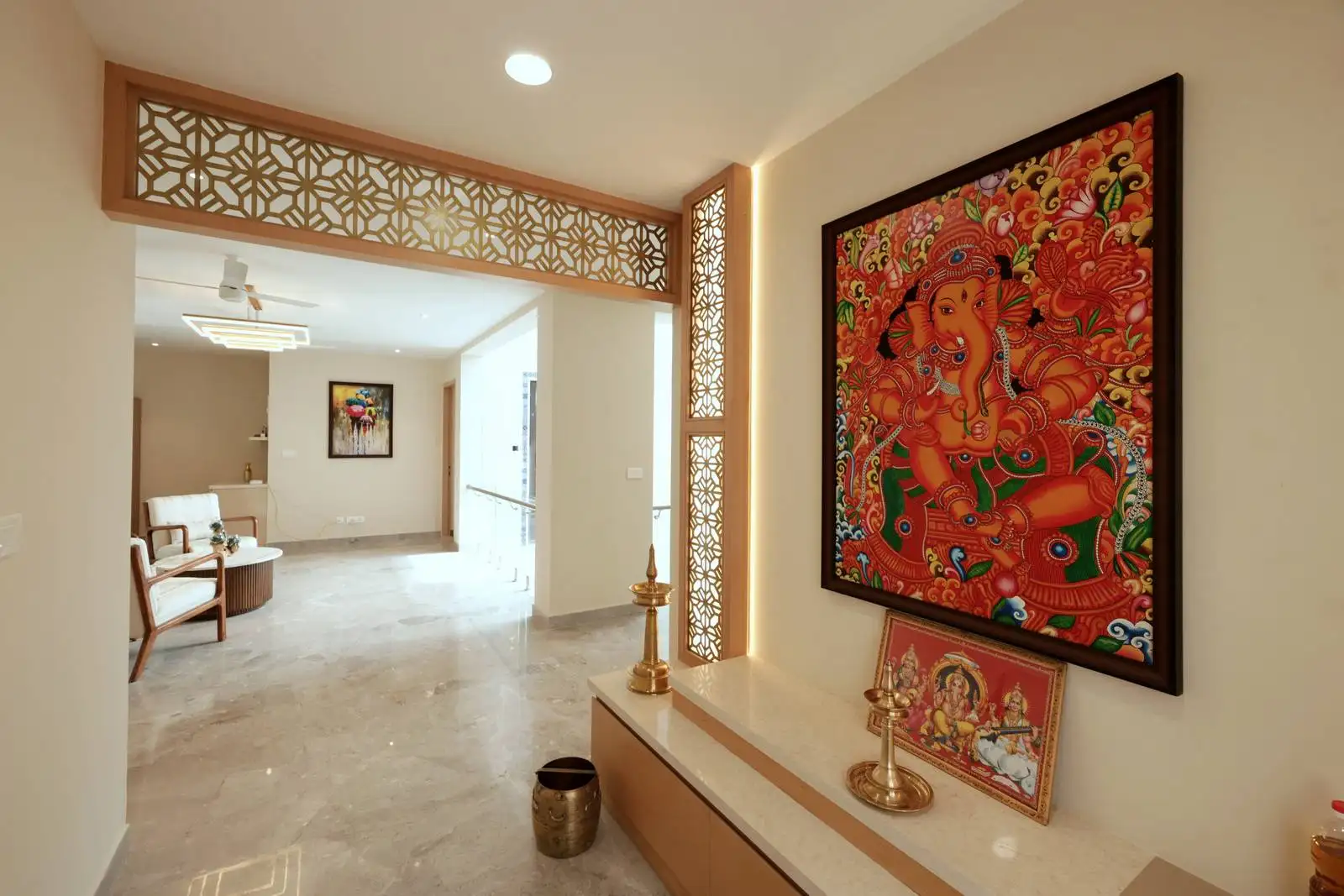 The second floor Semi-open pooja room integrated into the circulation area, yet visually distinct with jali partitions.