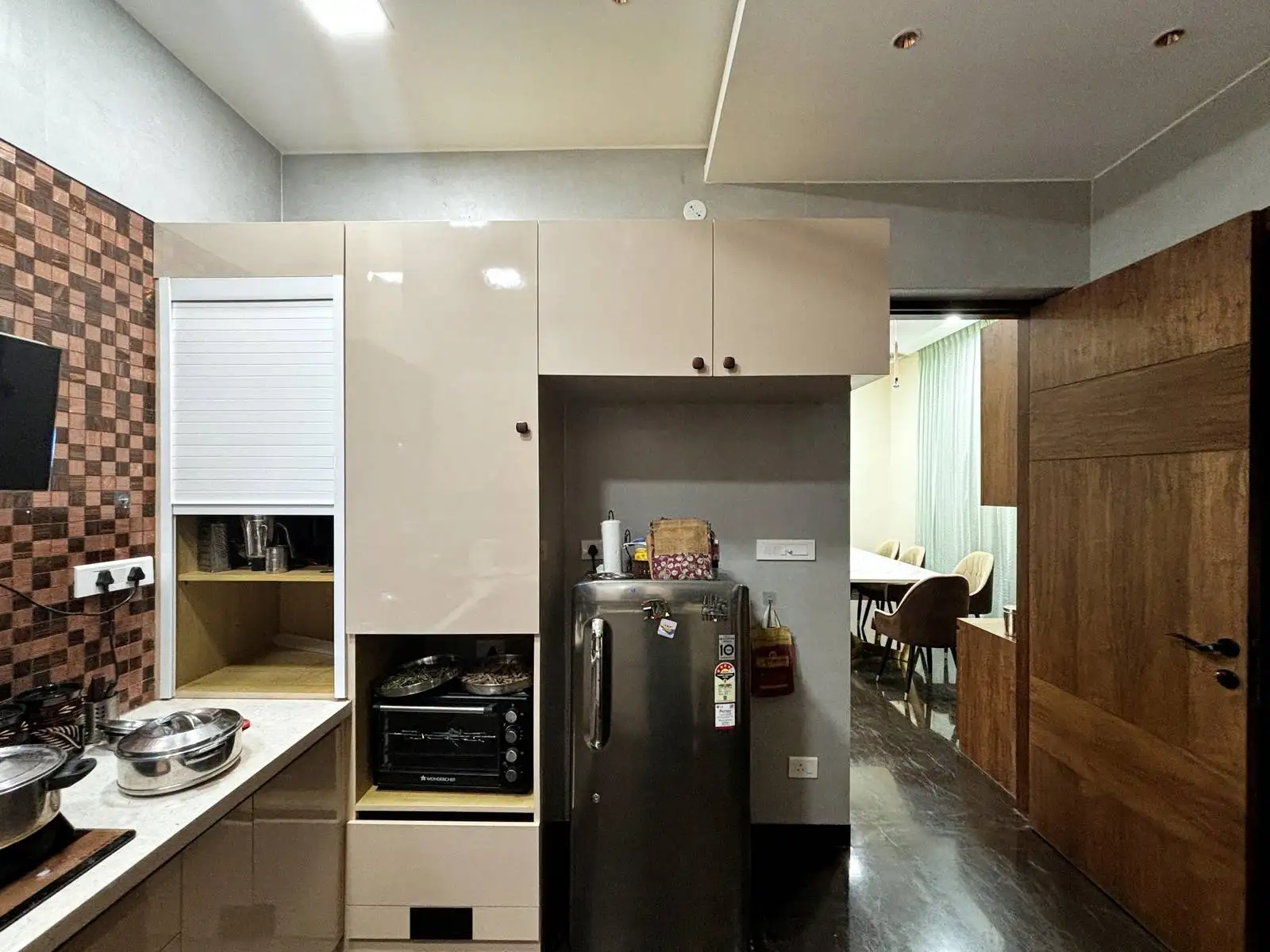 Countertops are finished in a light, solid surface material, providing durability and easy maintenance.
