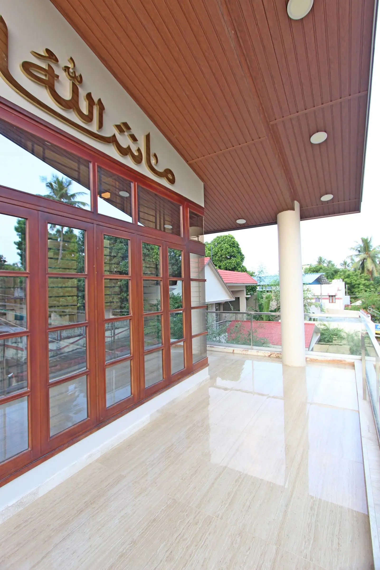 The clear glass railing provides unobstructed views of the surroundings and enhances the sense of openness.