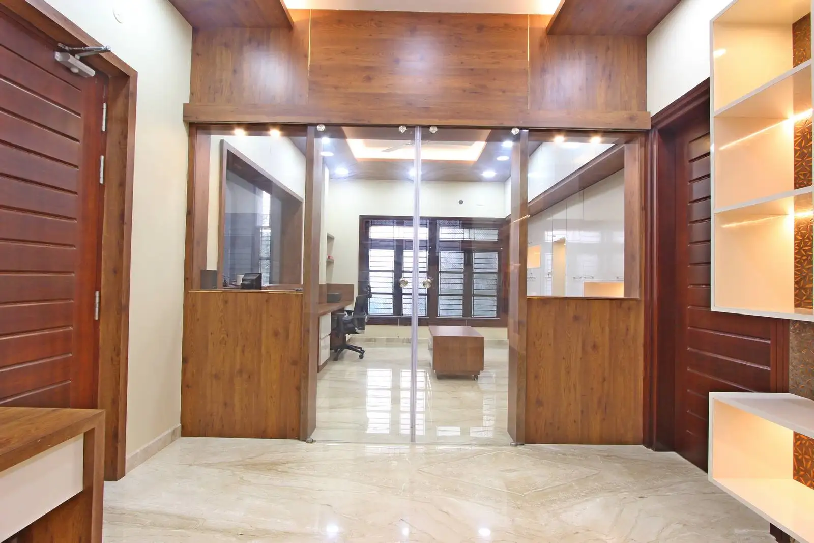 Glass partitions separate the kids’ study from the office, maintaining privacy while ensuring visual connection. The office faces the study area, enabling easy supervision and fostering family interaction for parents working from home.
