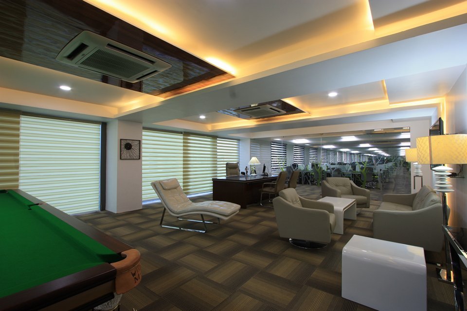The patterned flooring, thoughtfully designed to add texture and define distinct zones, enhances both the visual appeal and acoustic performance of the space.