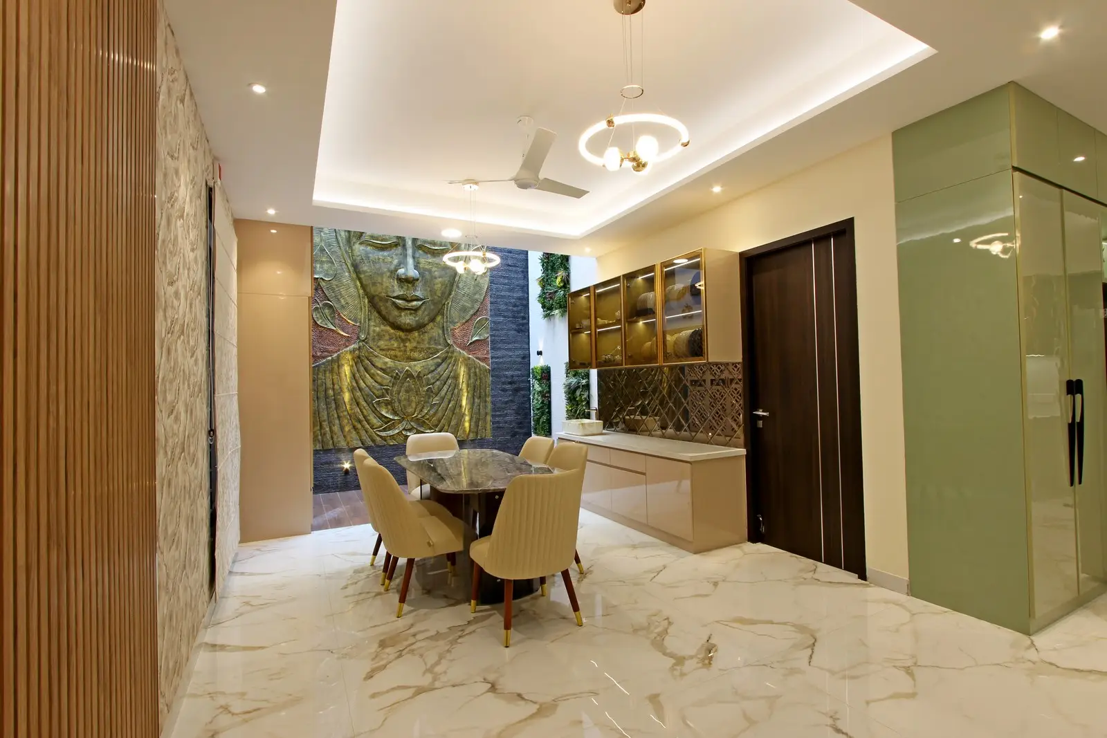 Radiating contemporary elegance, this dining space features polished marble flooring, a sleek marble-top table, and upholstered beige chairs that create a warm, inviting atmosphere.


